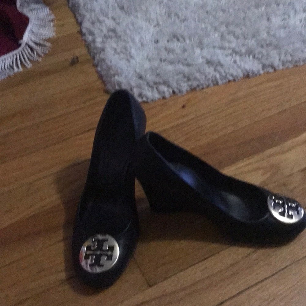 Gently used black leather wedges.